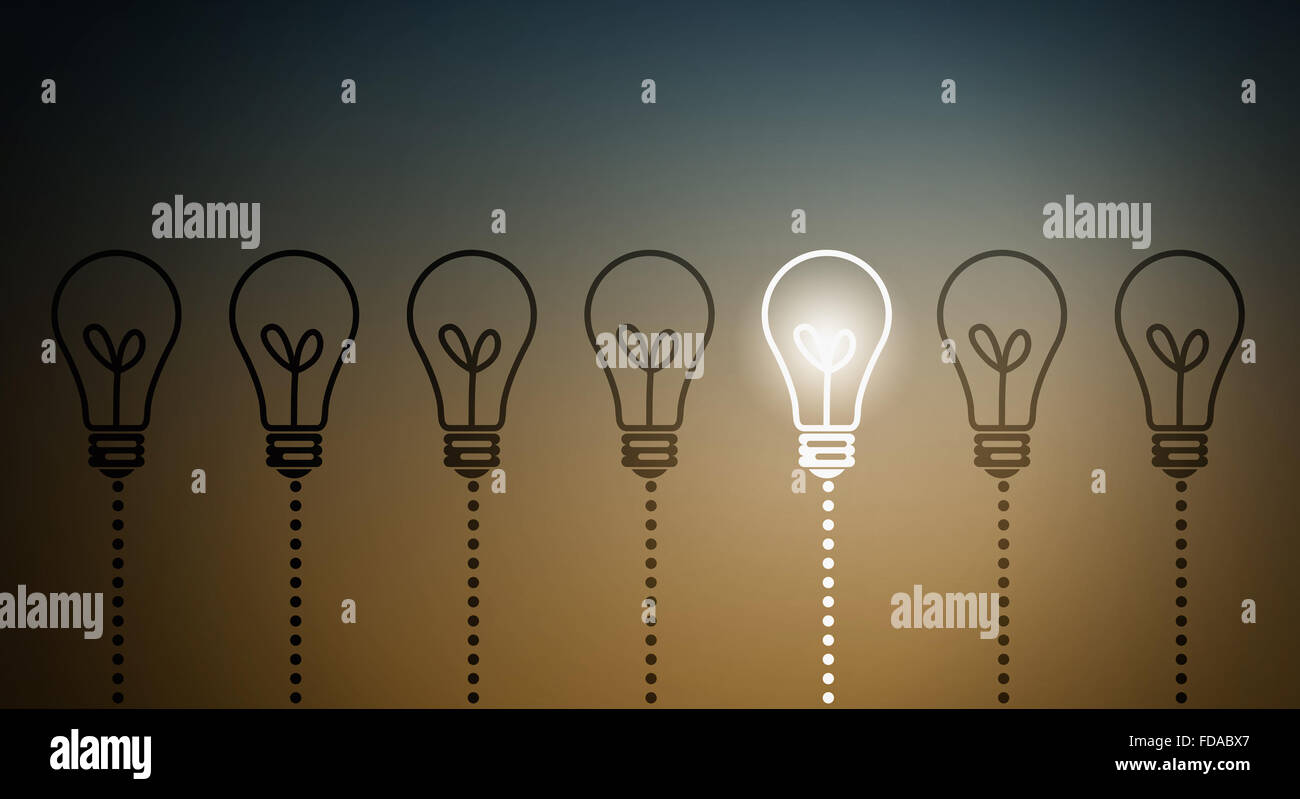 Light bulbs on dark background with one glowing Stock Photo - Alamy
