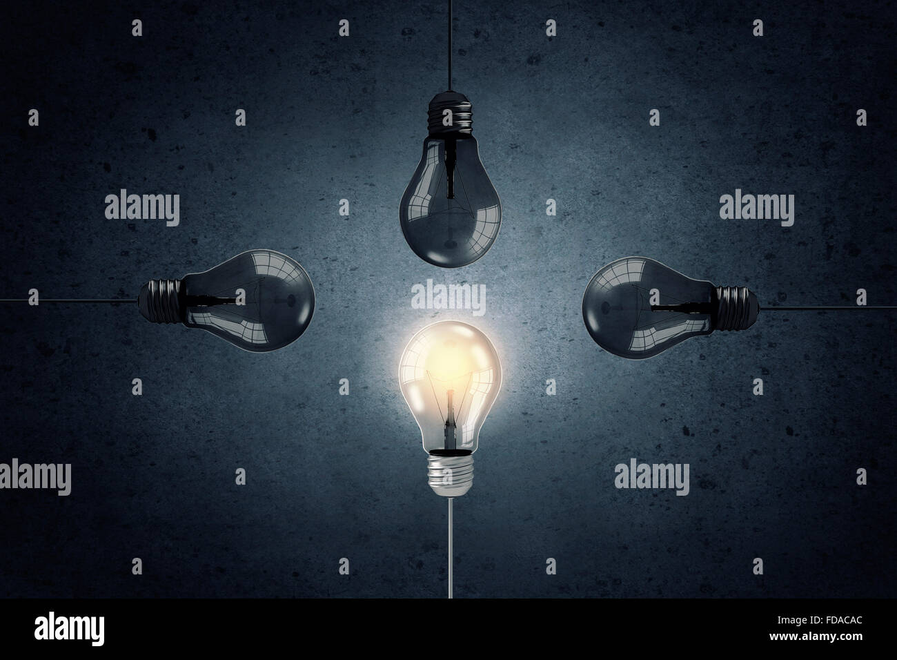 Light bulbs on dark background with one glowing Stock Photo - Alamy