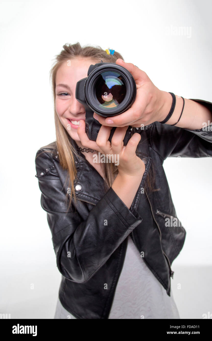 Teenage girl taking a photo with a camera Stock Photo