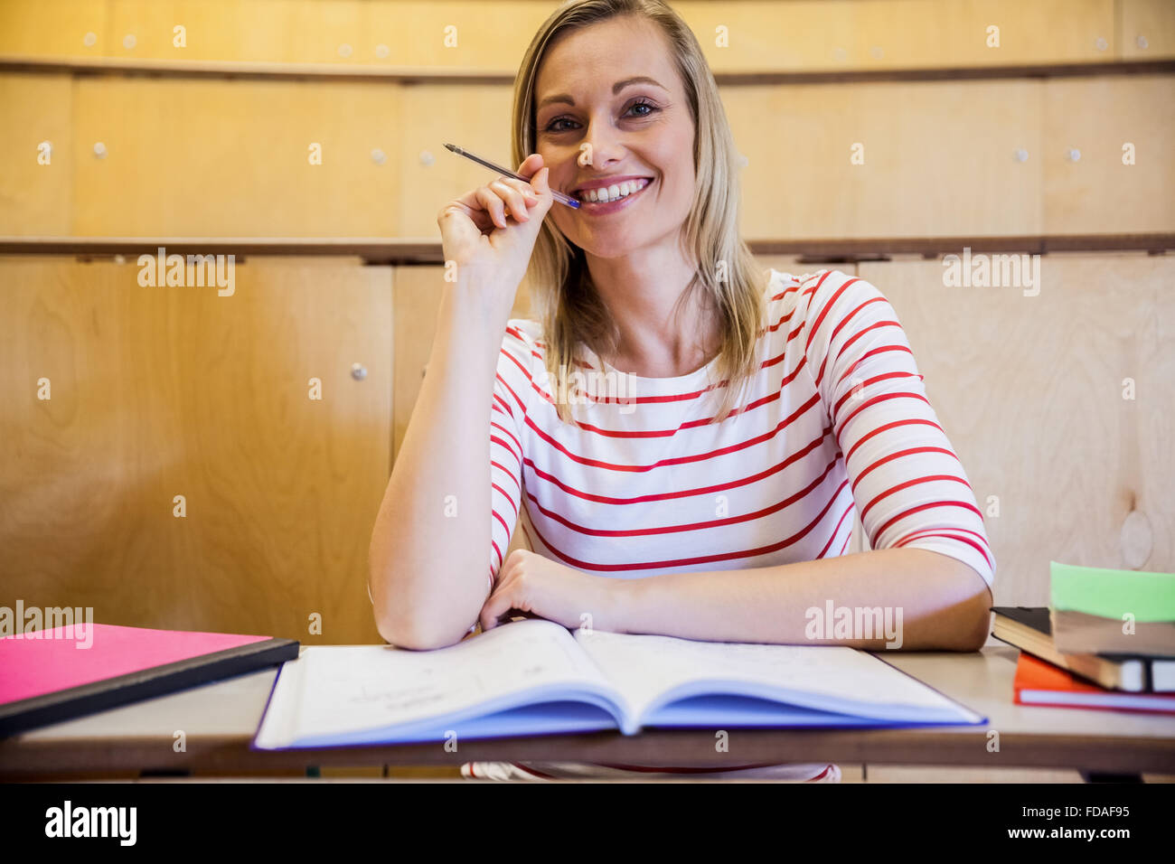 Happy female student smiling Stock Photo - Alamy