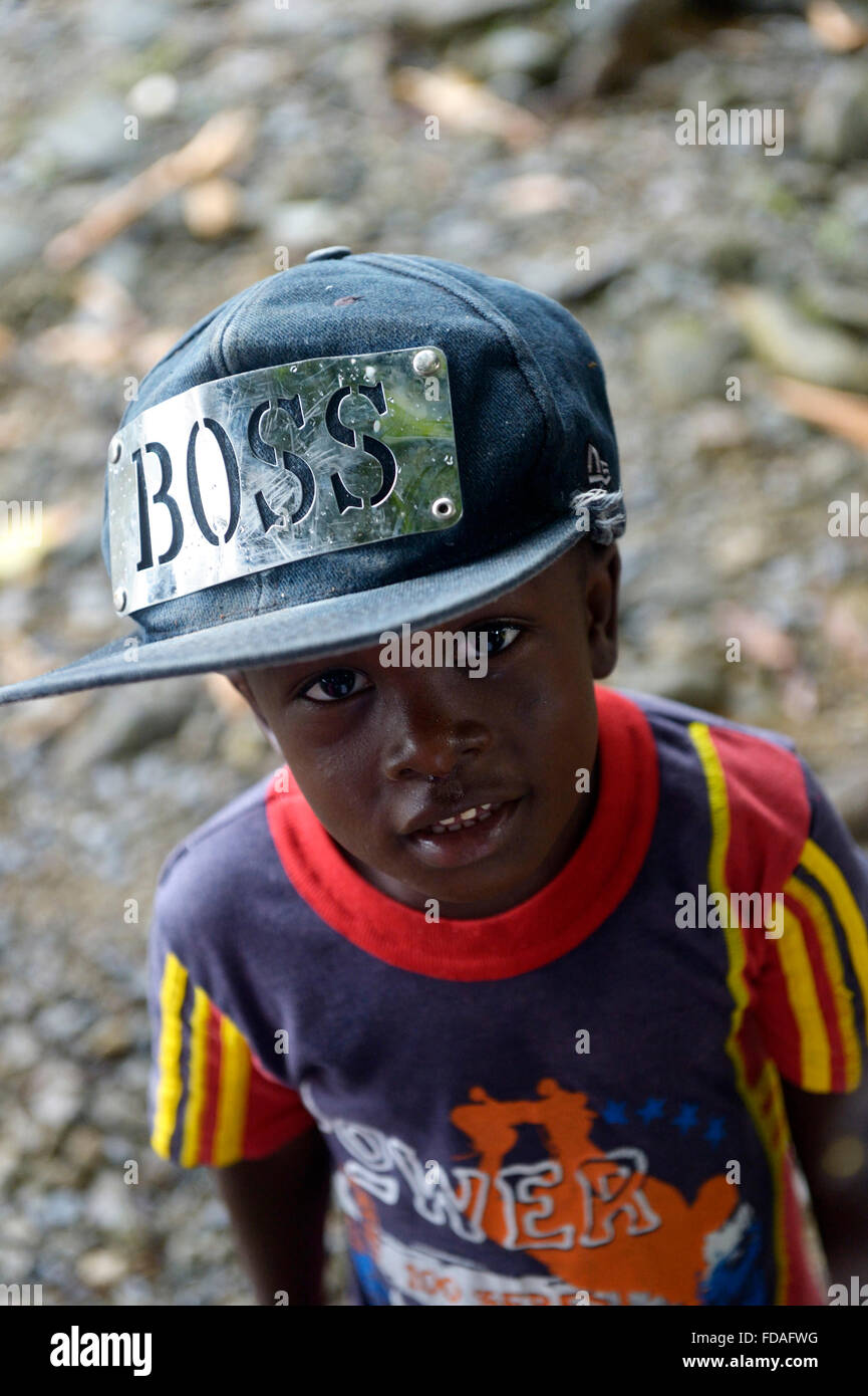 Boy with hat by Boss, afro-columbian village of Playa Bonita on the river Rio Andagueda, Chocó Department, Colombia Stock Photo