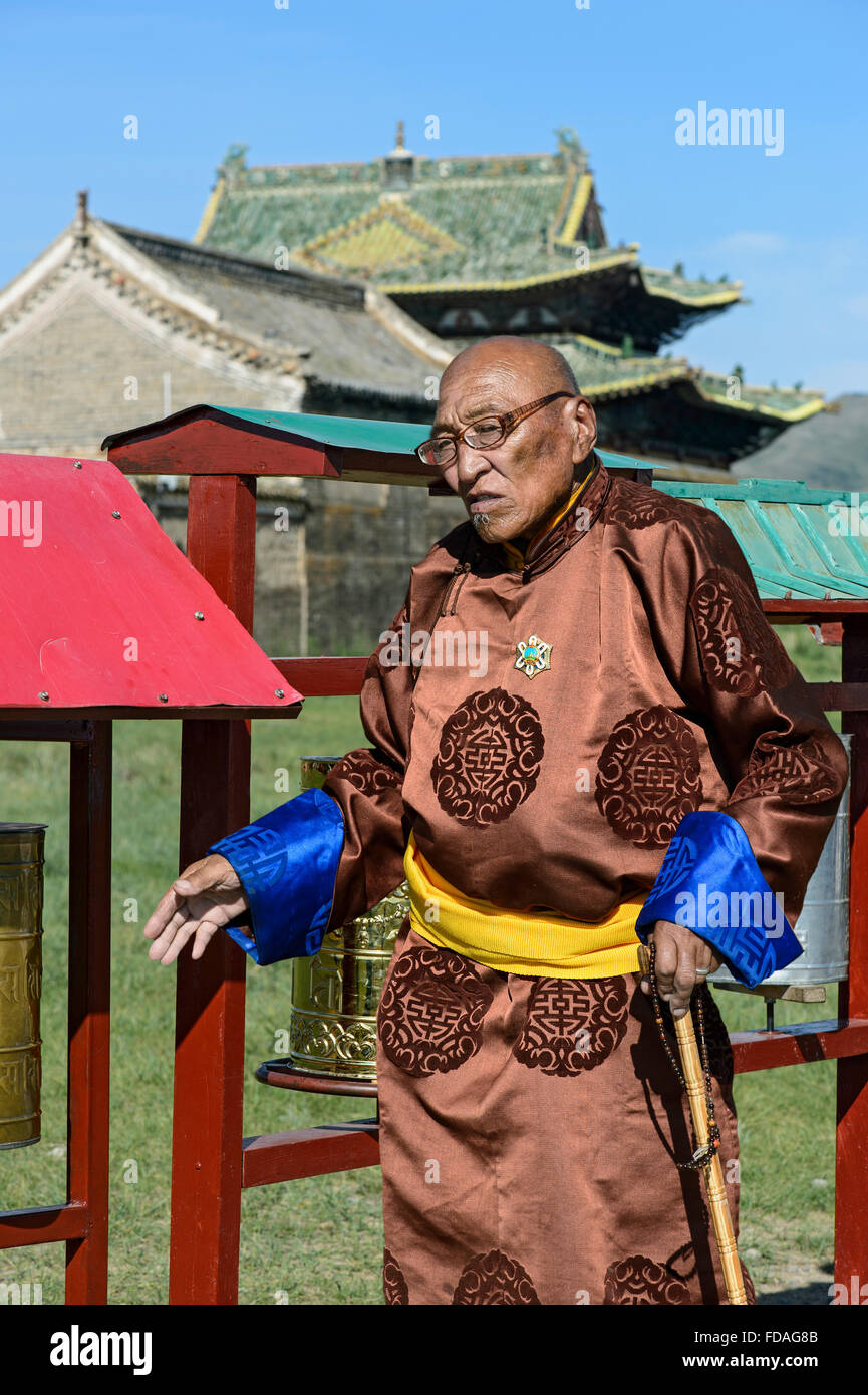 Old man in traditional Mongolian costume with Buddhist prayer beads in left hand, Erdene Zuu Monastery, Kharkhorin, UNESCO World Stock Photo