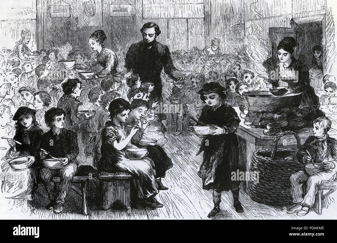 POVERTY Halfpenny Dinners for poor children in London's East End about 1868 Stock Photo