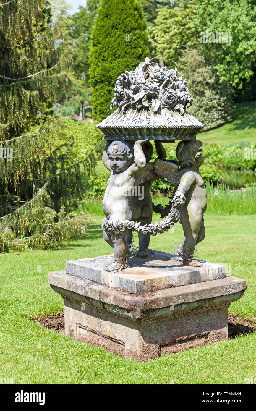 A sculpture in lead by van Nost depicting three cherubs at Cholmondeley Castle Cheshire, England UK Stock Photo