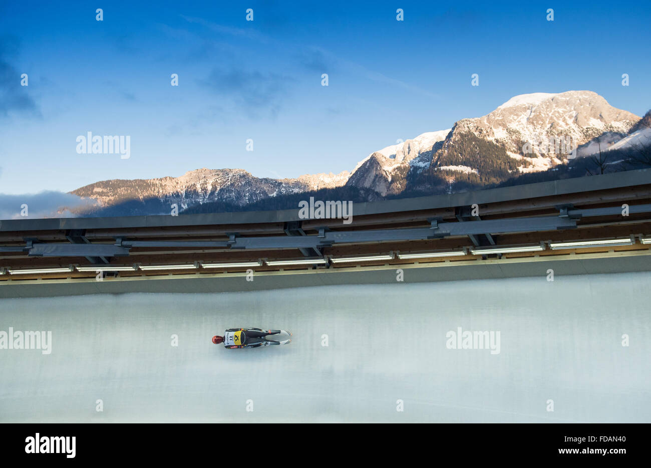 German tobogganer Ralf Palik in action on the ice channel with an