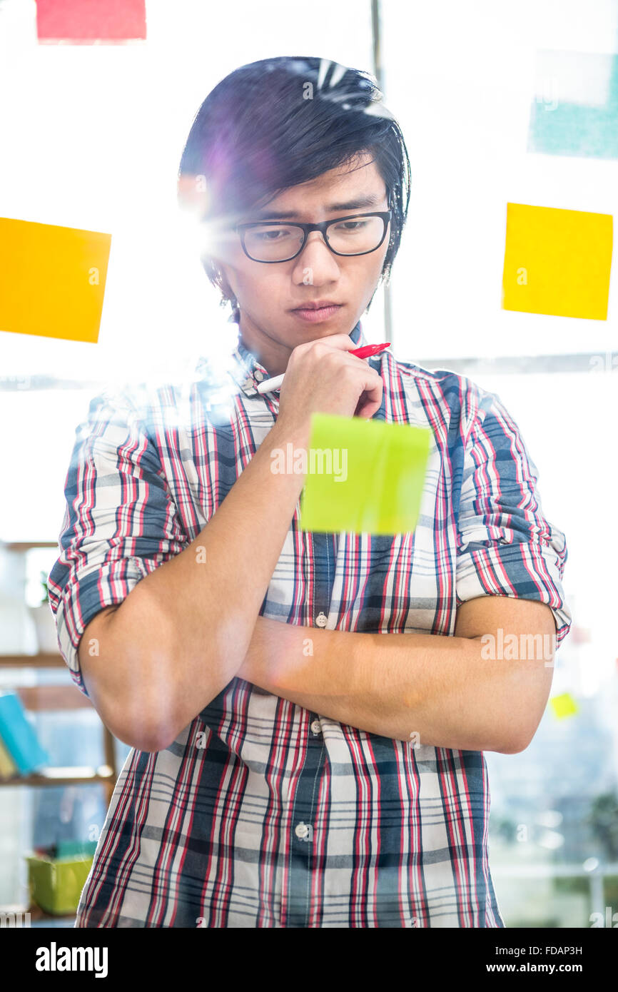 Creative businessman writing on sticky notes Stock Photo - Alamy