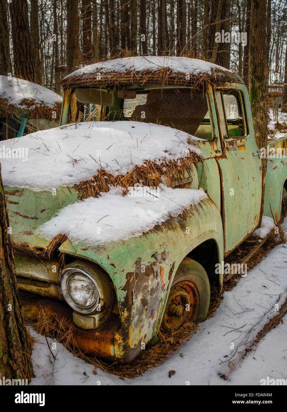 Rusty broke down old truck covered in snow Stock Photo - Alamy