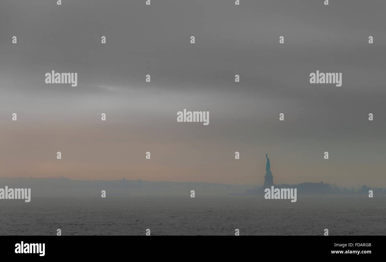 Statue Of Liberty In Fog, Upper New York Bay on Liberty Island, New York USA Stock Photo