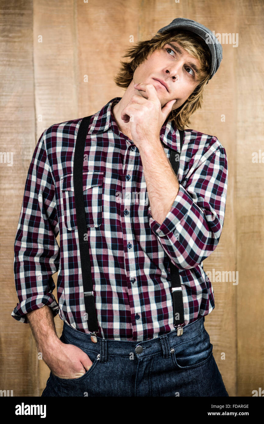 Focused hipster man thinking Stock Photo - Alamy