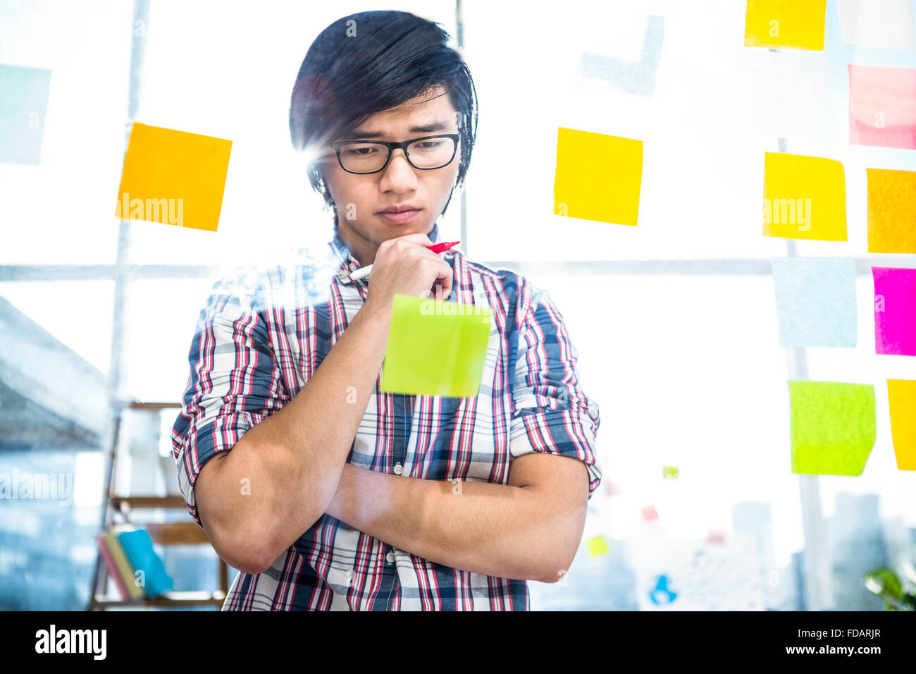 Creative businessman writing on sticky notes Stock Photo - Alamy