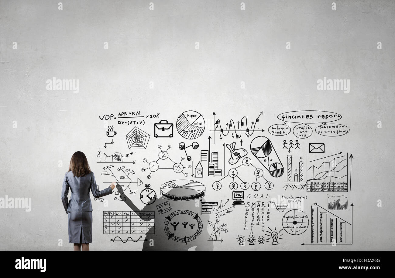 Rear view of young businesswoman drawing strategy plan on screen Stock ...