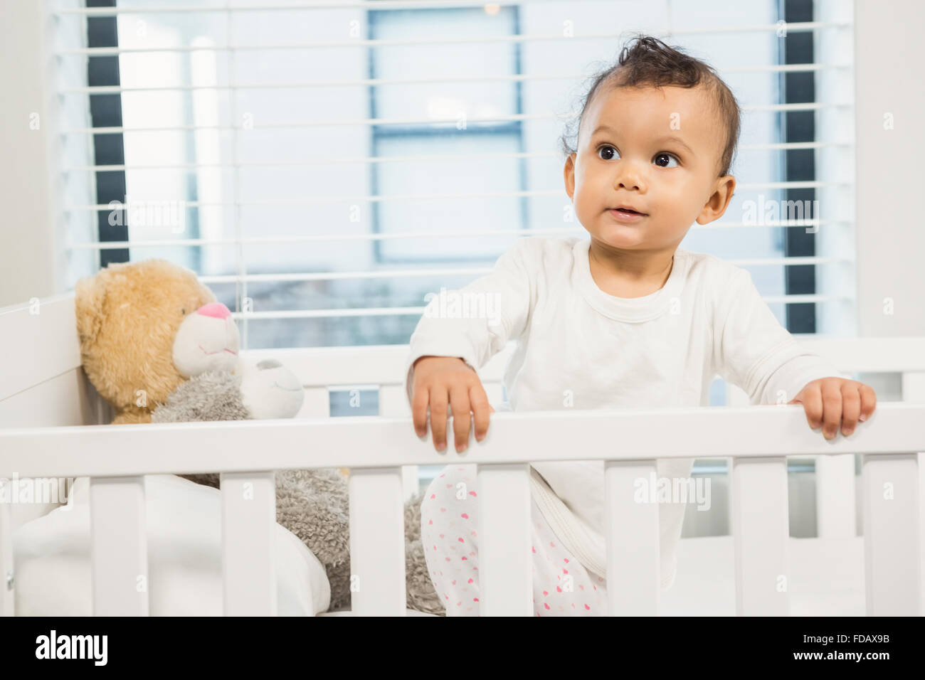 Cute baby in the crib Stock Photo Alamy