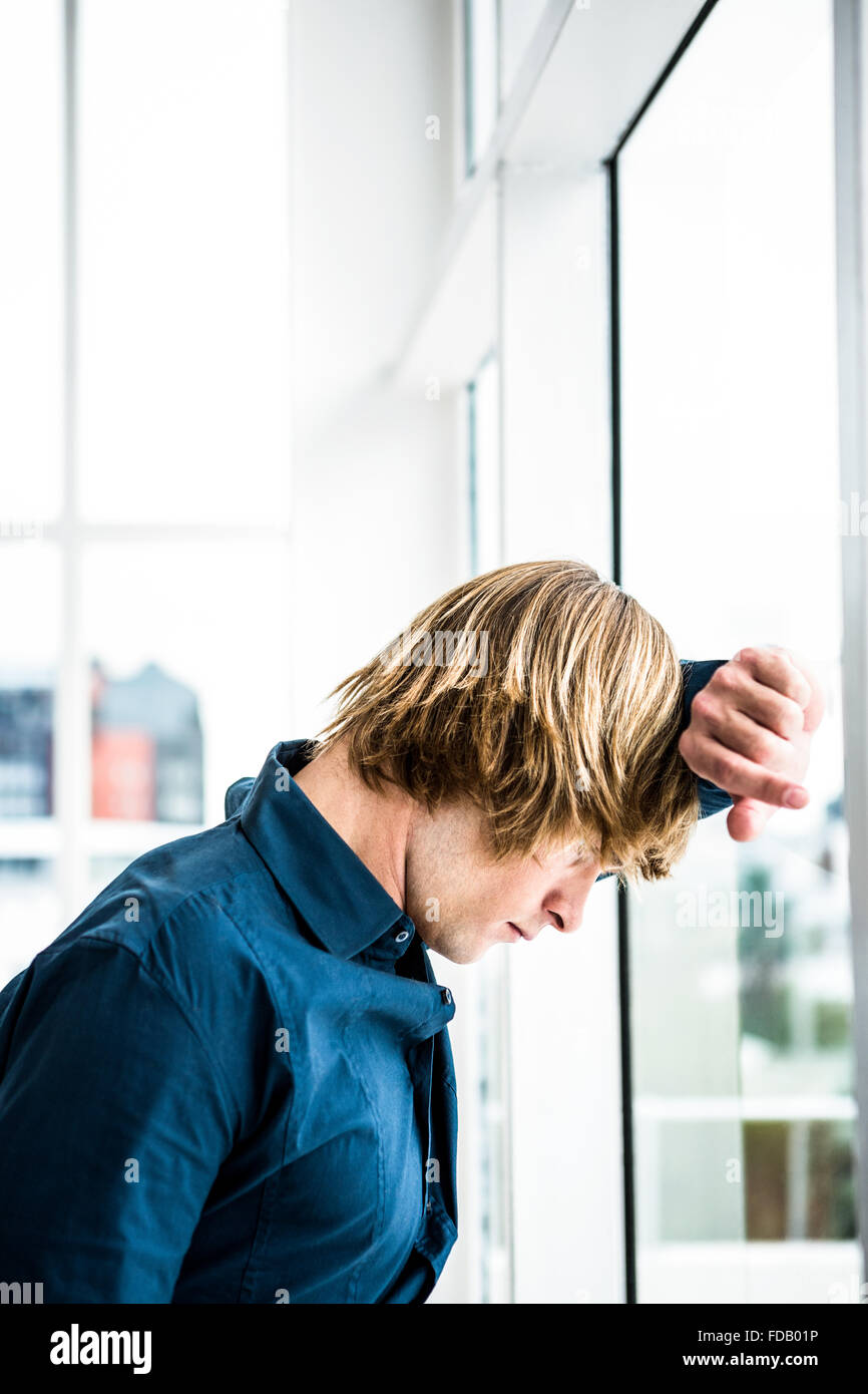 Sad man leaning out of window hi-res stock photography and images - Alamy