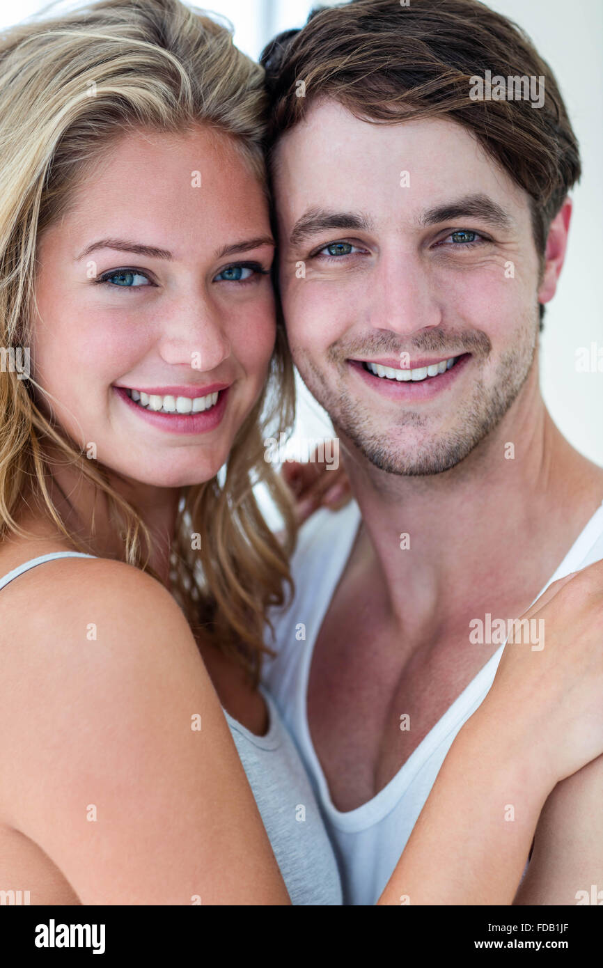 Happy couple hugging at home Stock Photo - Alamy
