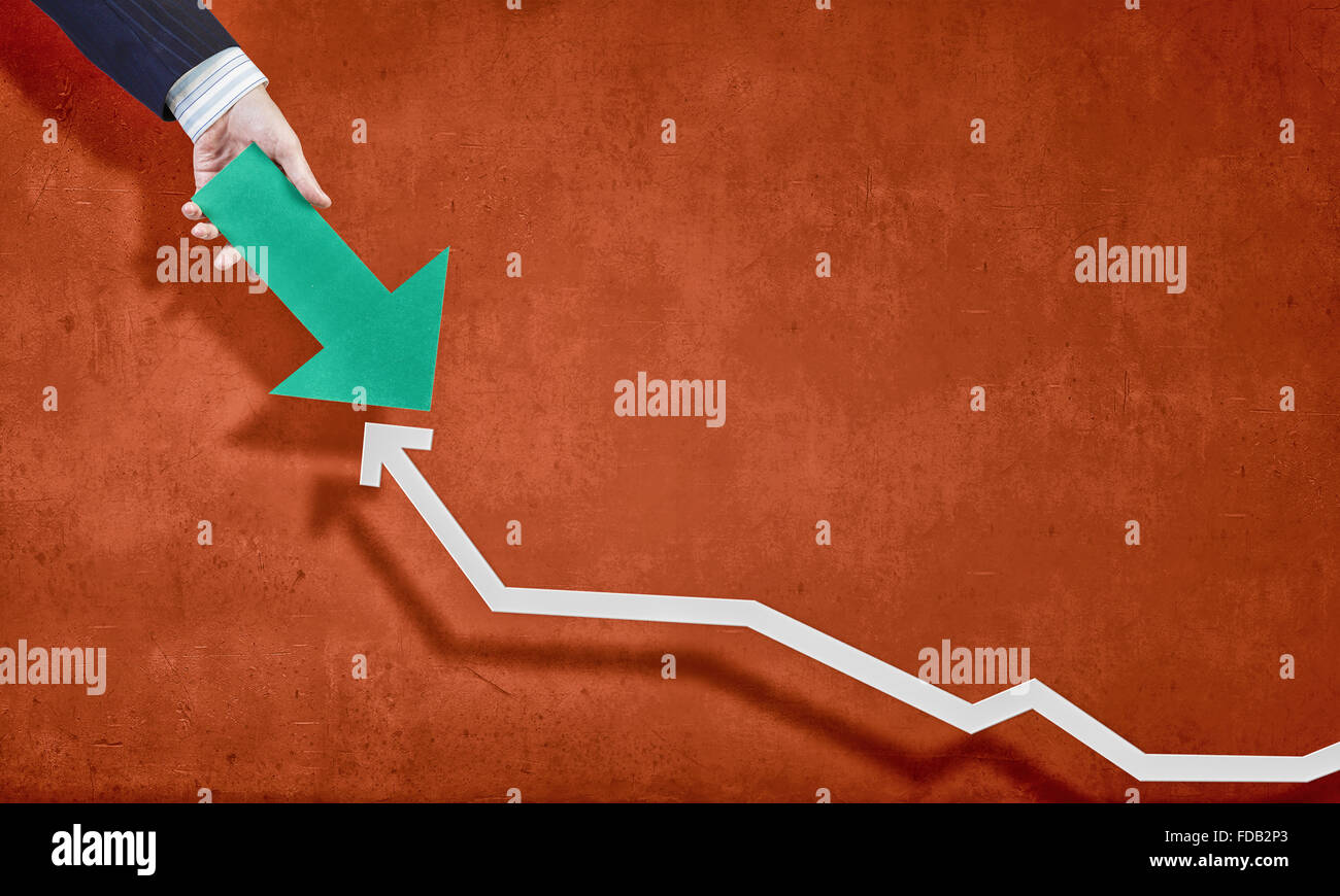 Hand holding arrow representing business growth concept Stock Photo - Alamy