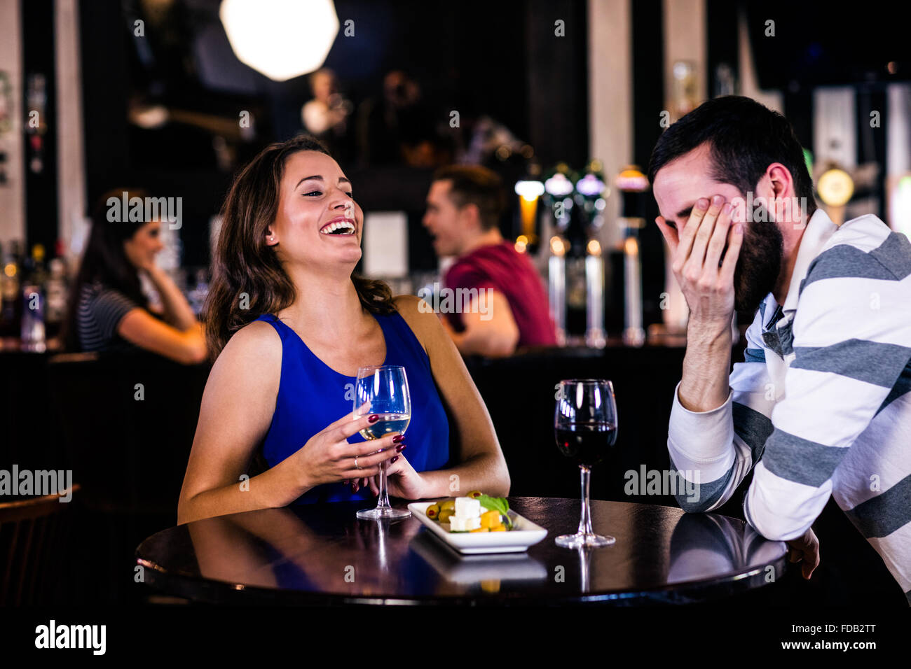 Couple having a glass of wine Stock Photo - Alamy