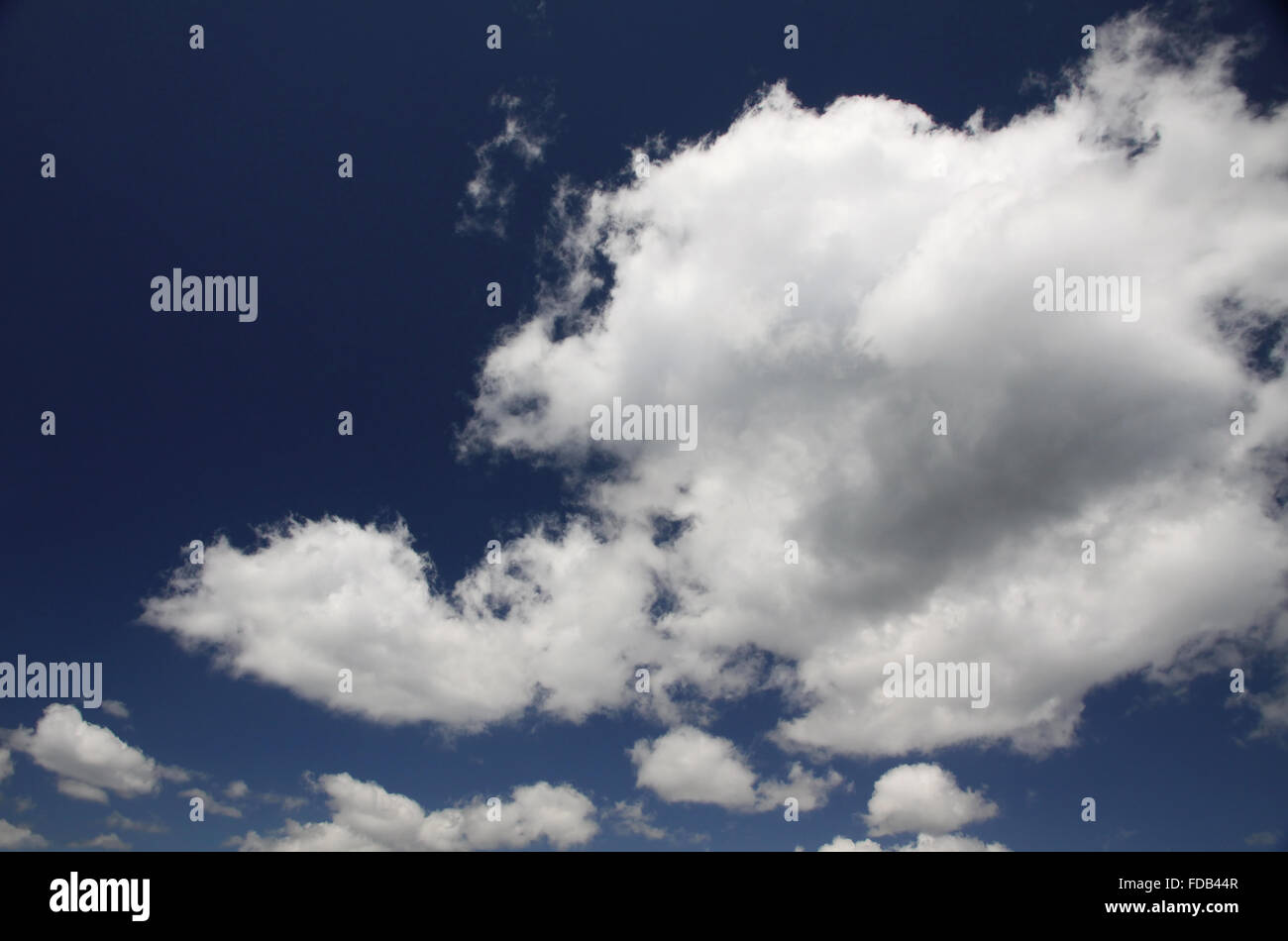 Blue sky with white fluffy clouds Stock Photo