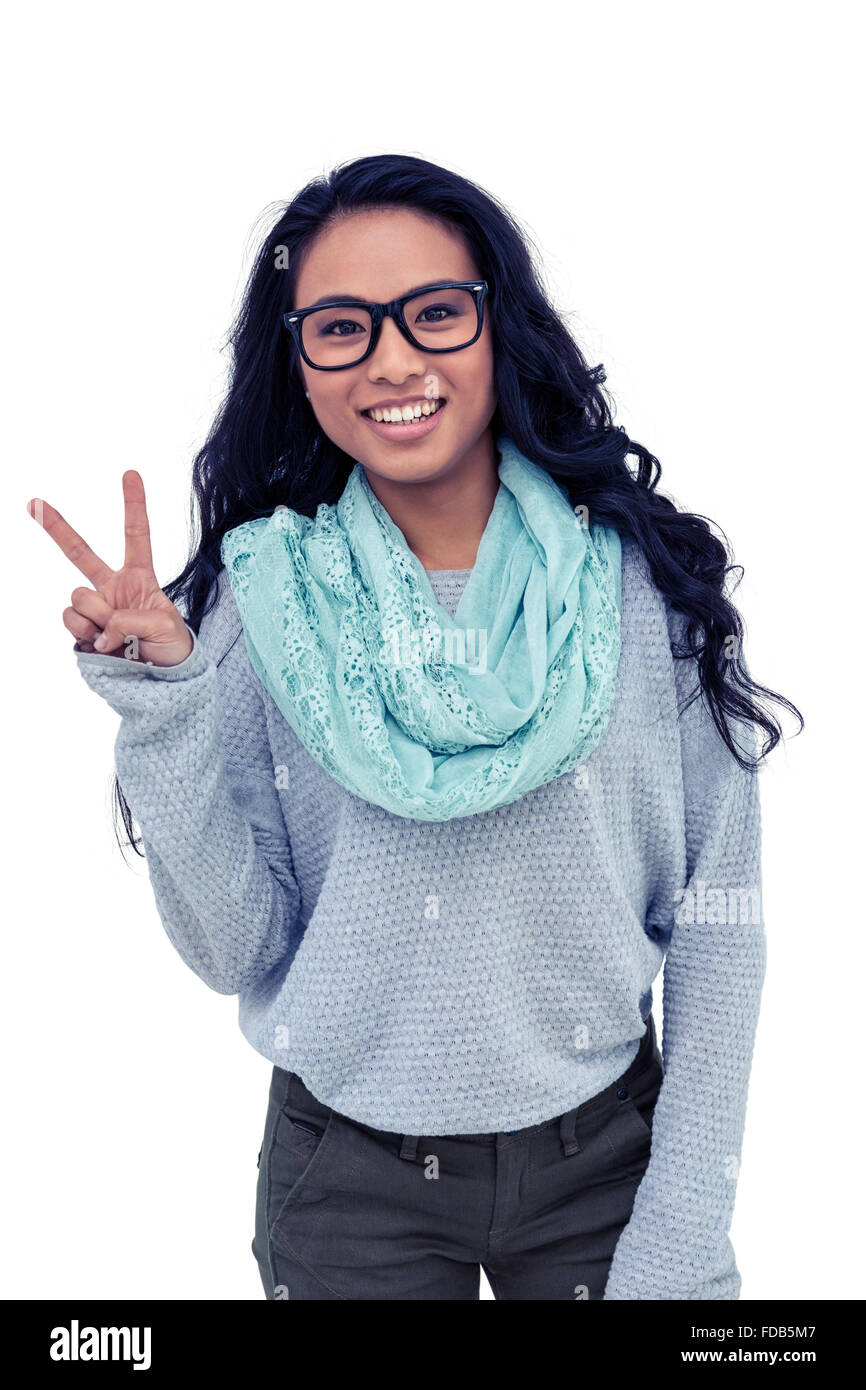 Asian woman making peace sign with hand Stock Photo