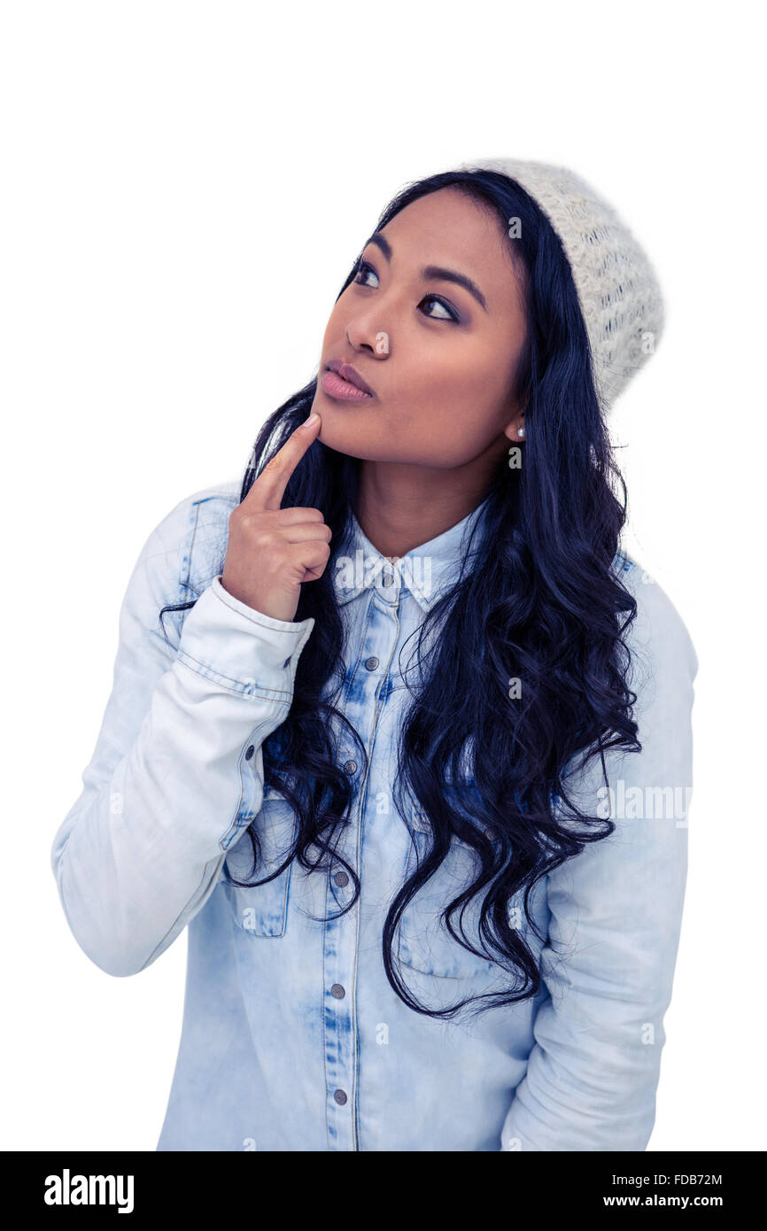 Asian woman with finger on chin Stock Photo - Alamy