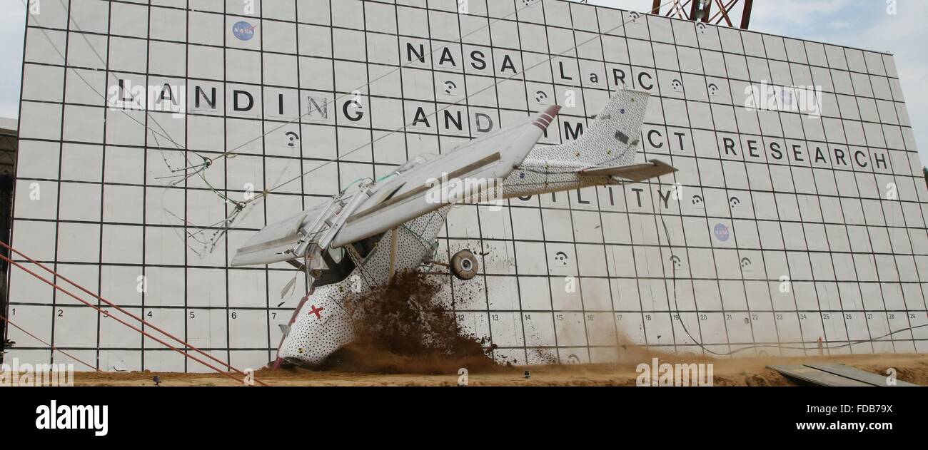 A Cessna 172 aircraft is dropped to the concrete from 82 feet at the Landing and Impact Research Facility at NASA's Langley Research Center July 26, 2015 in Hampton, Virginia. The test is to improve general aviation emergency locator beacons which often fail after a crash and are critical for search and rescue. Stock Photo