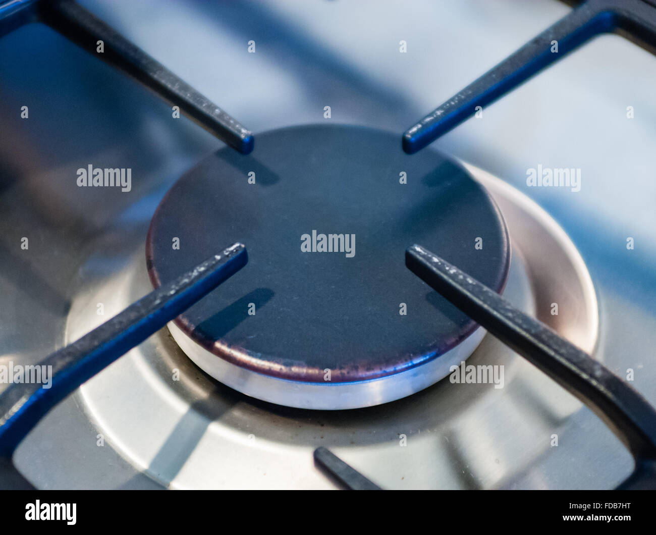 Close-up of metallic kitchen stove burner. Stock Photo