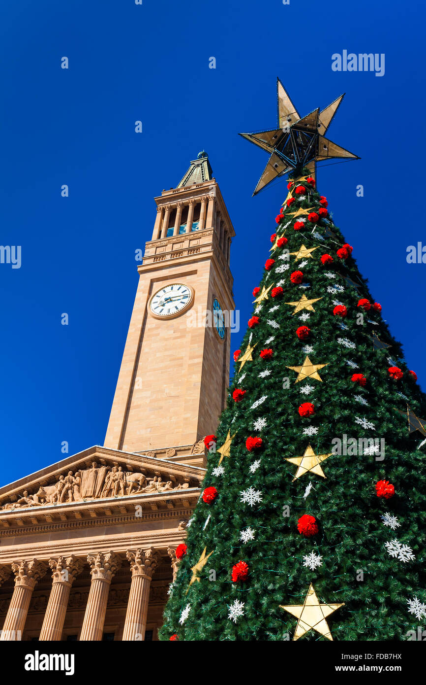 Brisbane city Christmas tree and a City Hall tower against the blue sky