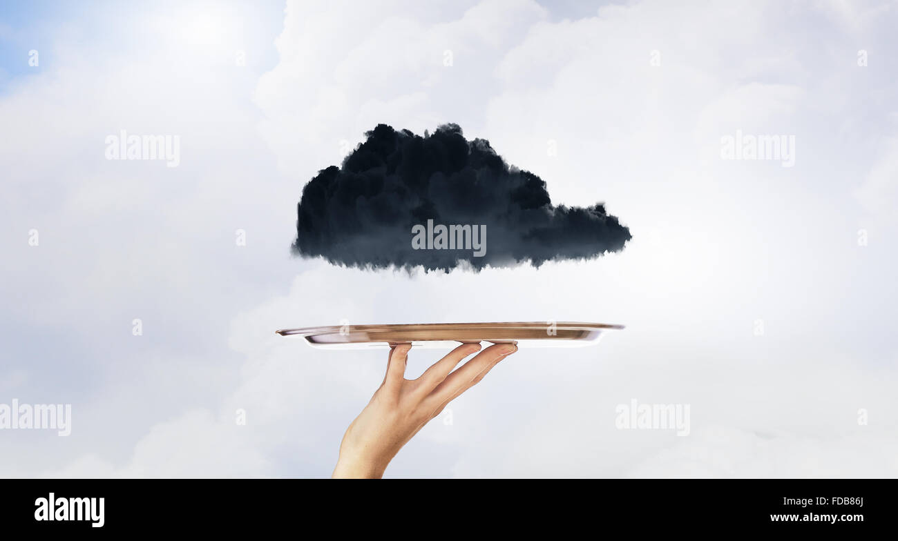 Human hand holding metal tray with black cloud Stock Photo - Alamy