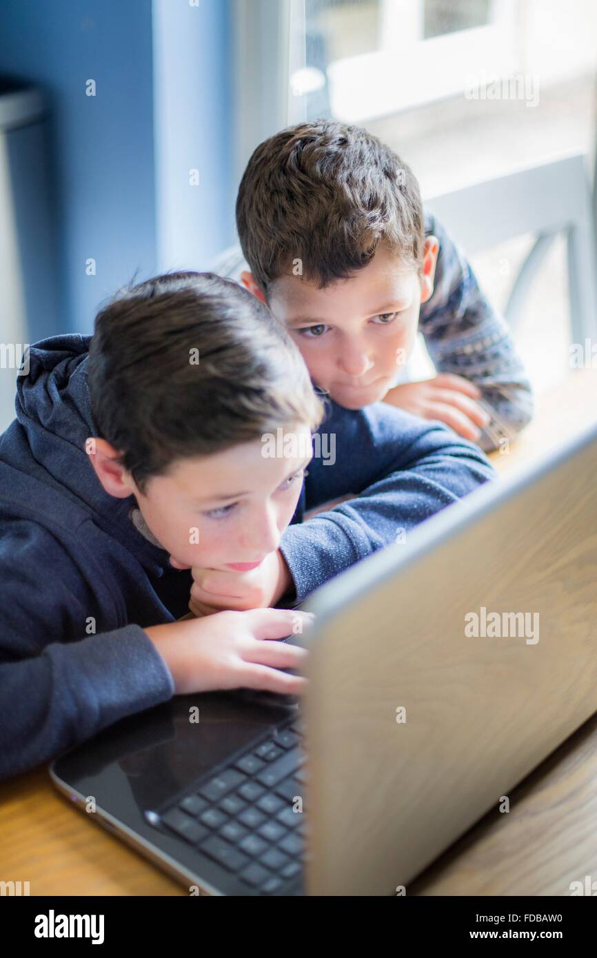 MODEL RELEASED. Two boys using a laptop computer Stock Photo - Alamy