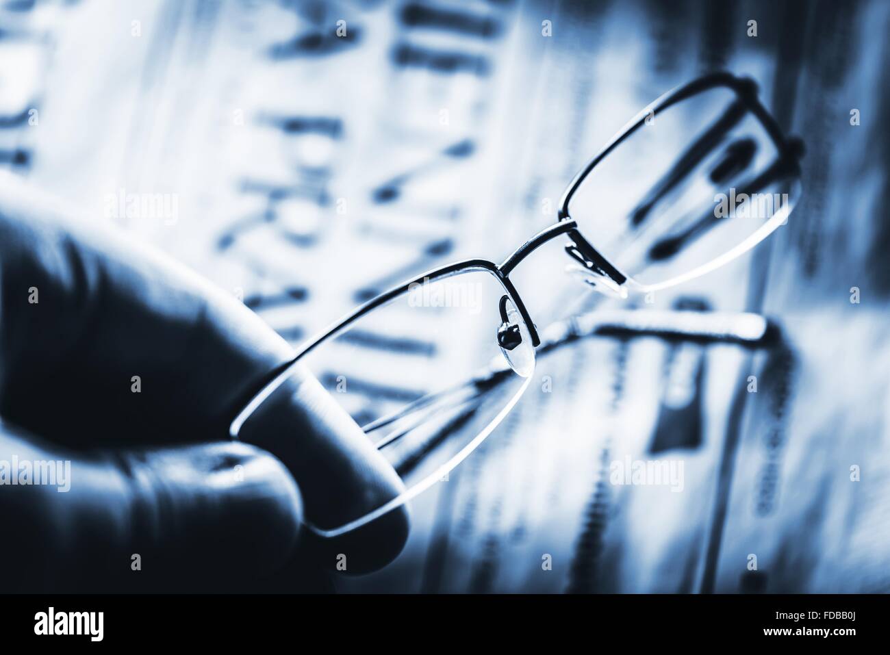 Reading Glasses. Visual Correction Concept Photo. Mono Blue Color Grading. Stock Photo