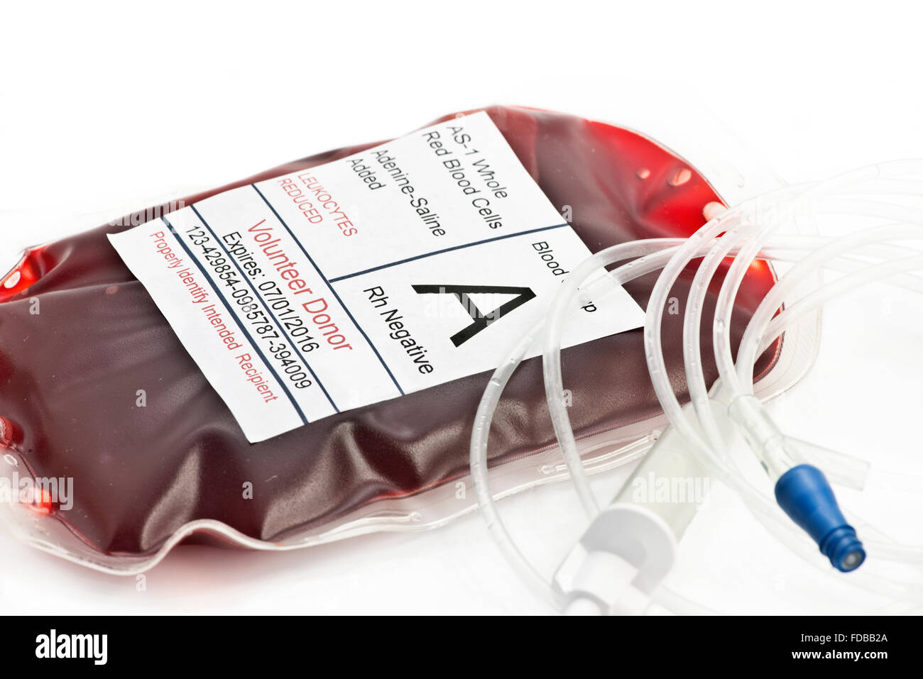 Blood transfusion bag with IV tubing.  Label is completely fictitious and the serial number is a total random number Stock Photo
