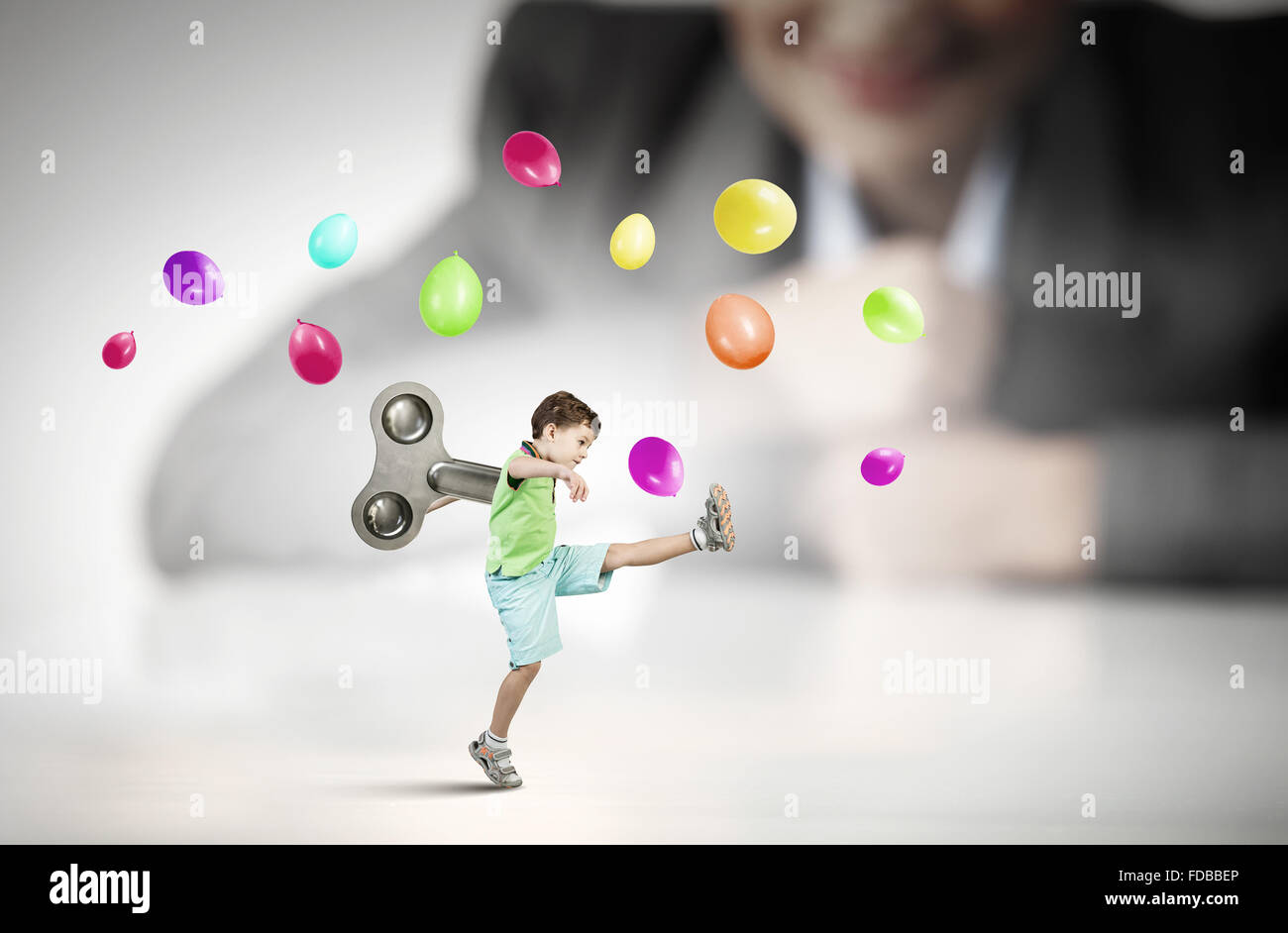 Little cute active boy with key on back Stock Photo
