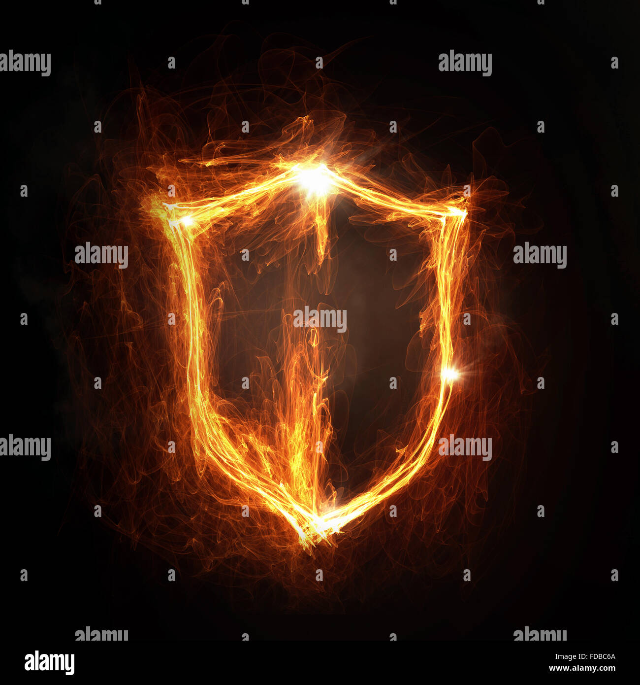 Glowing fire shield icon on dark background Stock Photo - Alamy