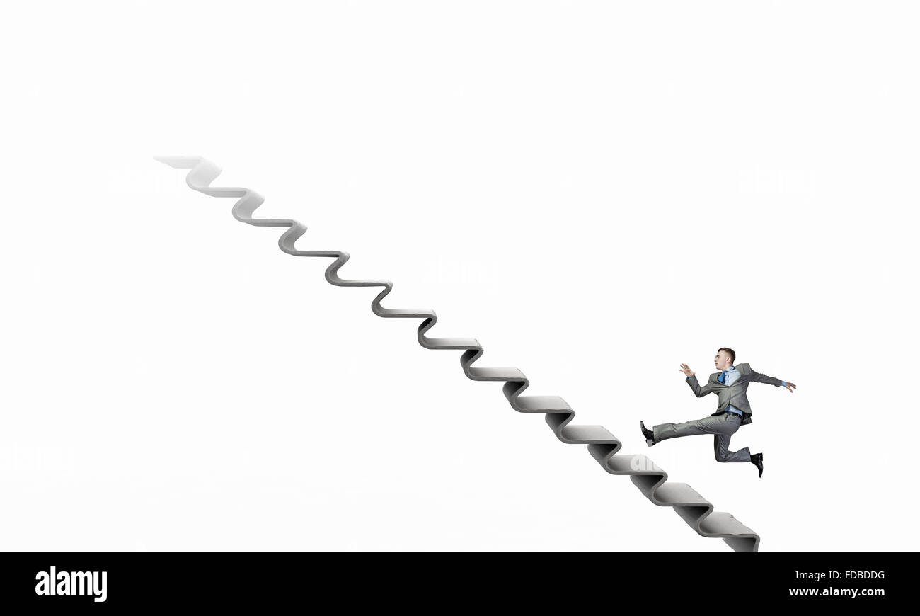 Young businessman running up on staircase representing success concept ...