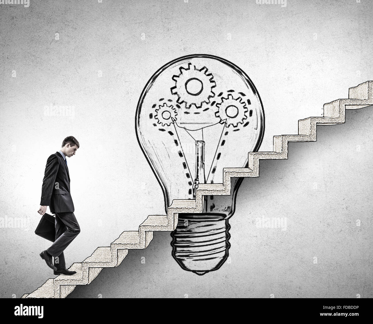 Young businessman walking up on staircase representing success concept ...