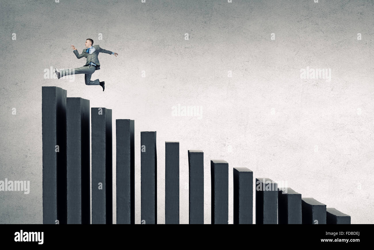 Young businessman running up on staircase representing success concept ...