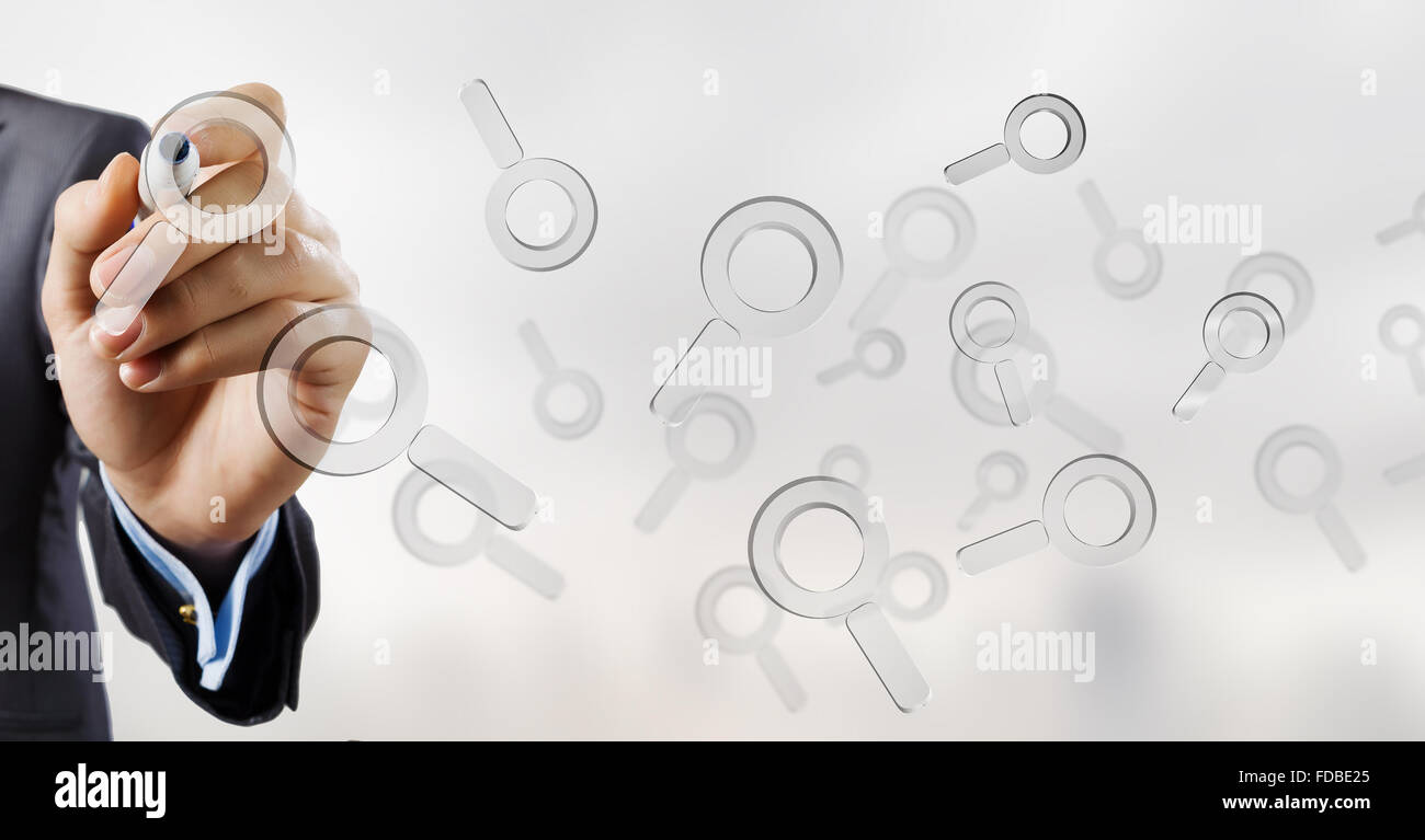 Businessman selecting with marker search glass icon on screen Stock ...