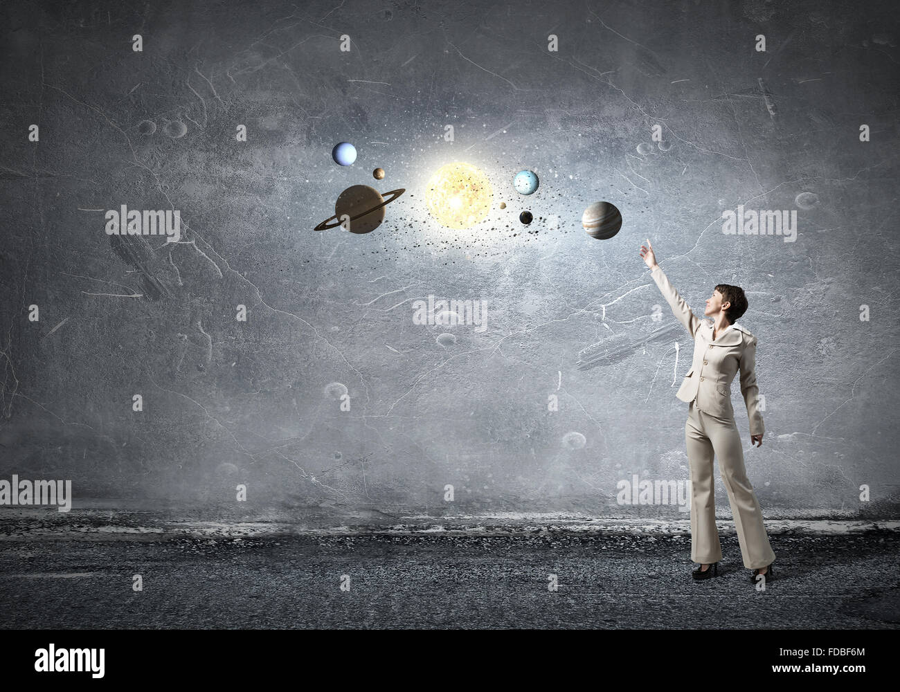 Young businesswoman reaching hand to space planets Stock Photo - Alamy