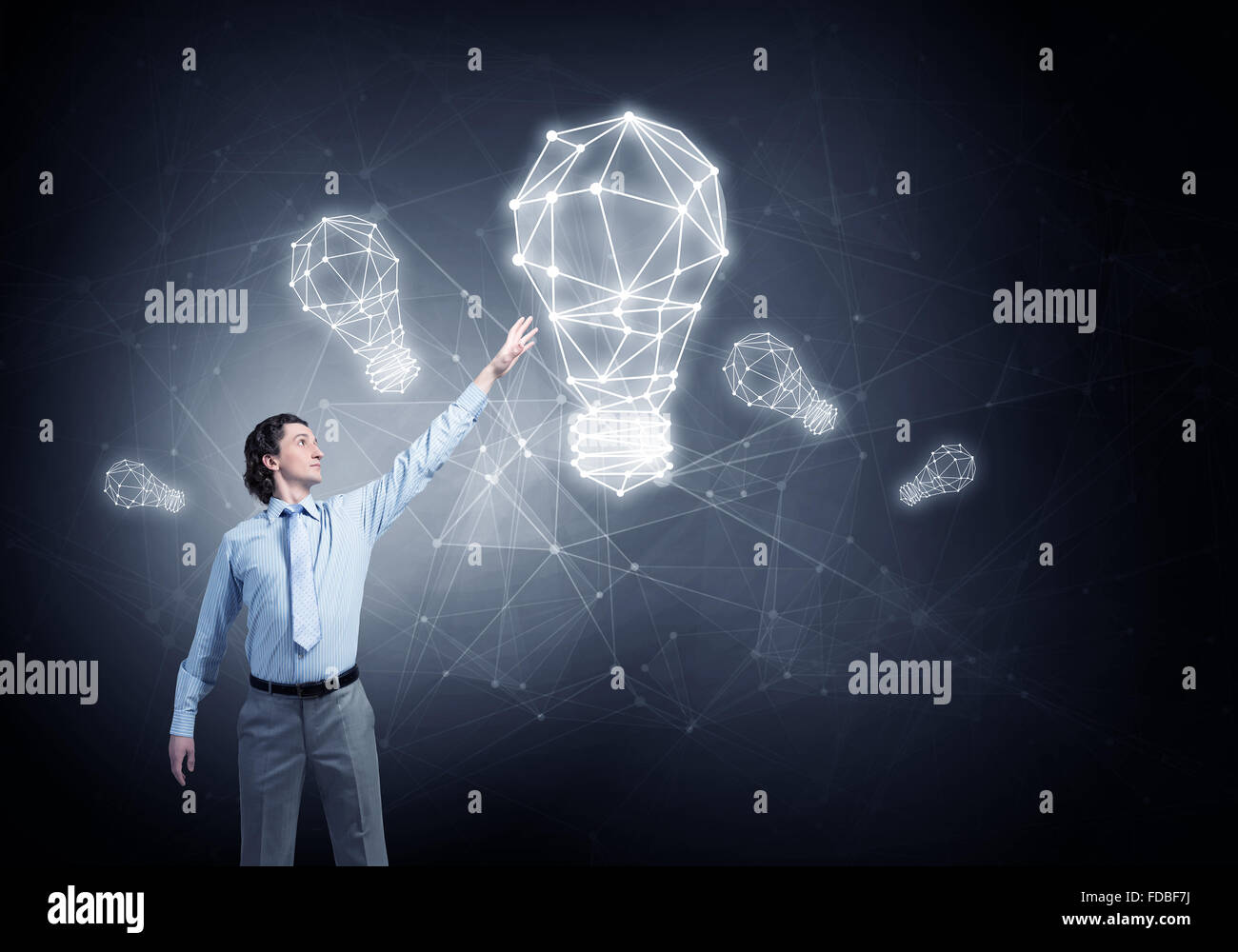 Businessman drawing connection lines with marker on screen Stock Photo