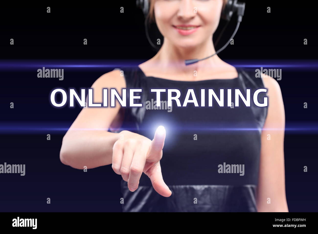 business, technology, internet and networking concept - businesswoman pressing online training button on virtual screens Stock Photo