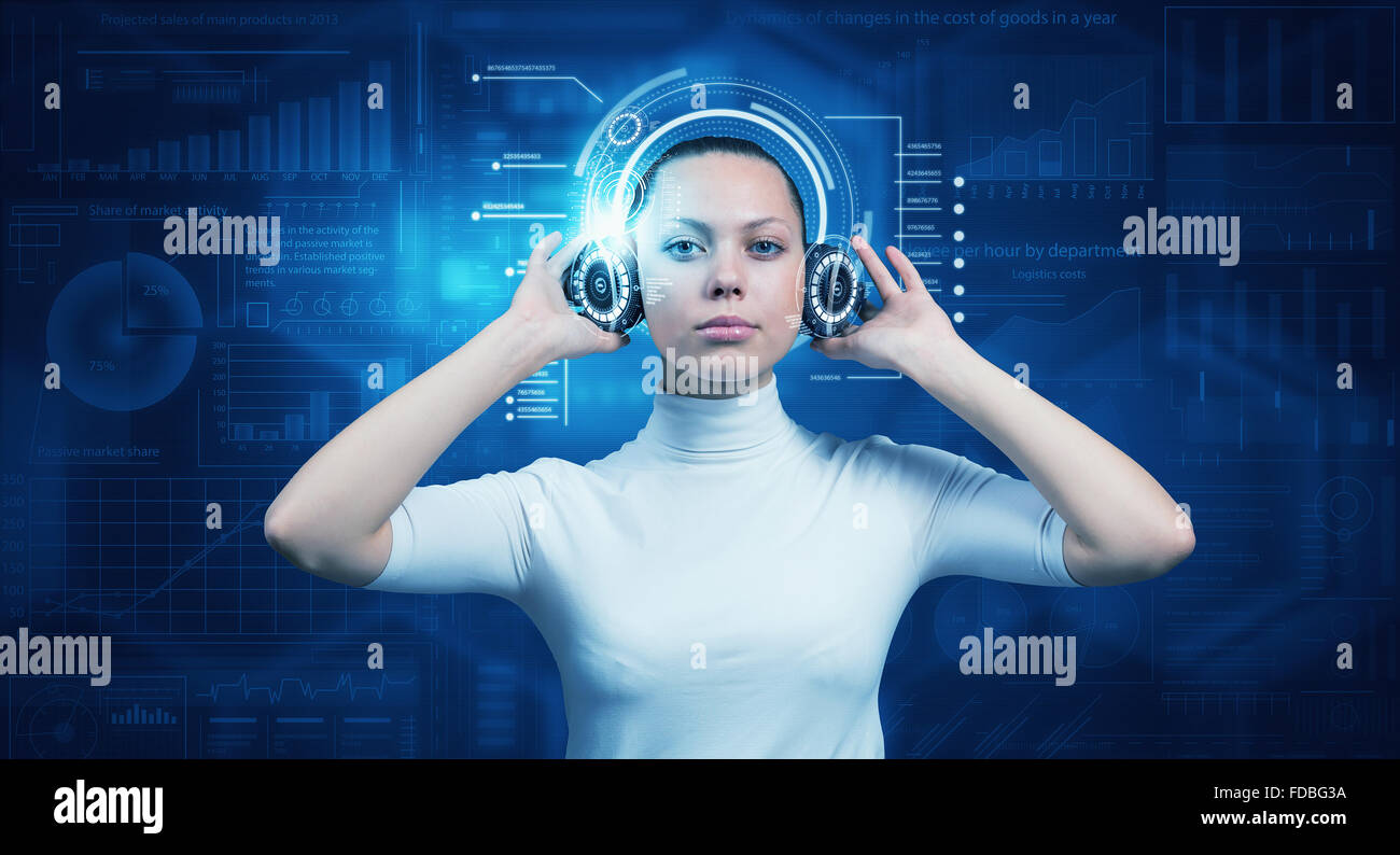 Young woman wearing headphones on virtual blue interface Stock Photo ...