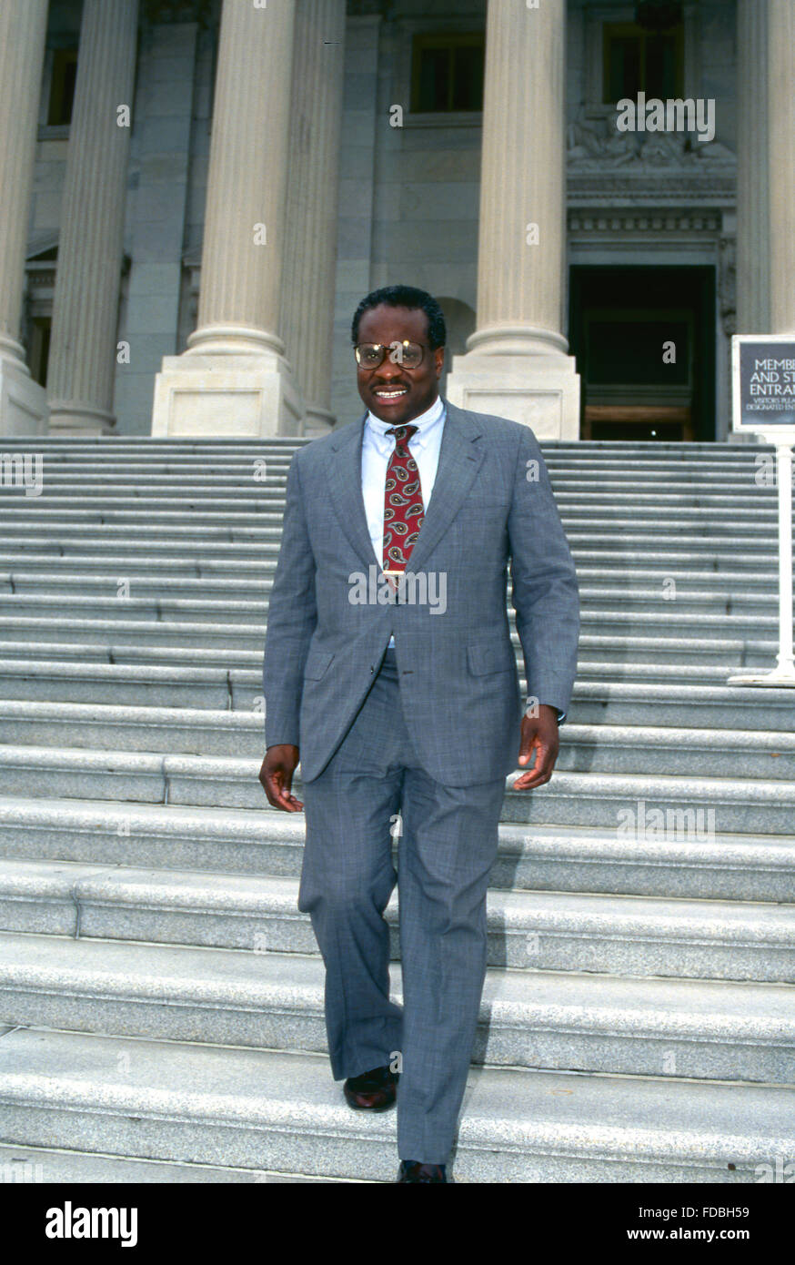 Washington, DC., USA, 9th July,1991 Judge Clarence Thomas walks down the center steps of the US Capitol after his first meeting with members of congress after being nominated to the US Supreme Court by President George H.W. Bush. Credit: Mark Reinstein Stock Photo