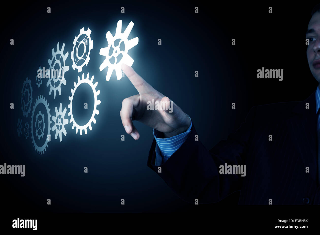 business-person-hand-touching-gear-mechanism-representing-interaction