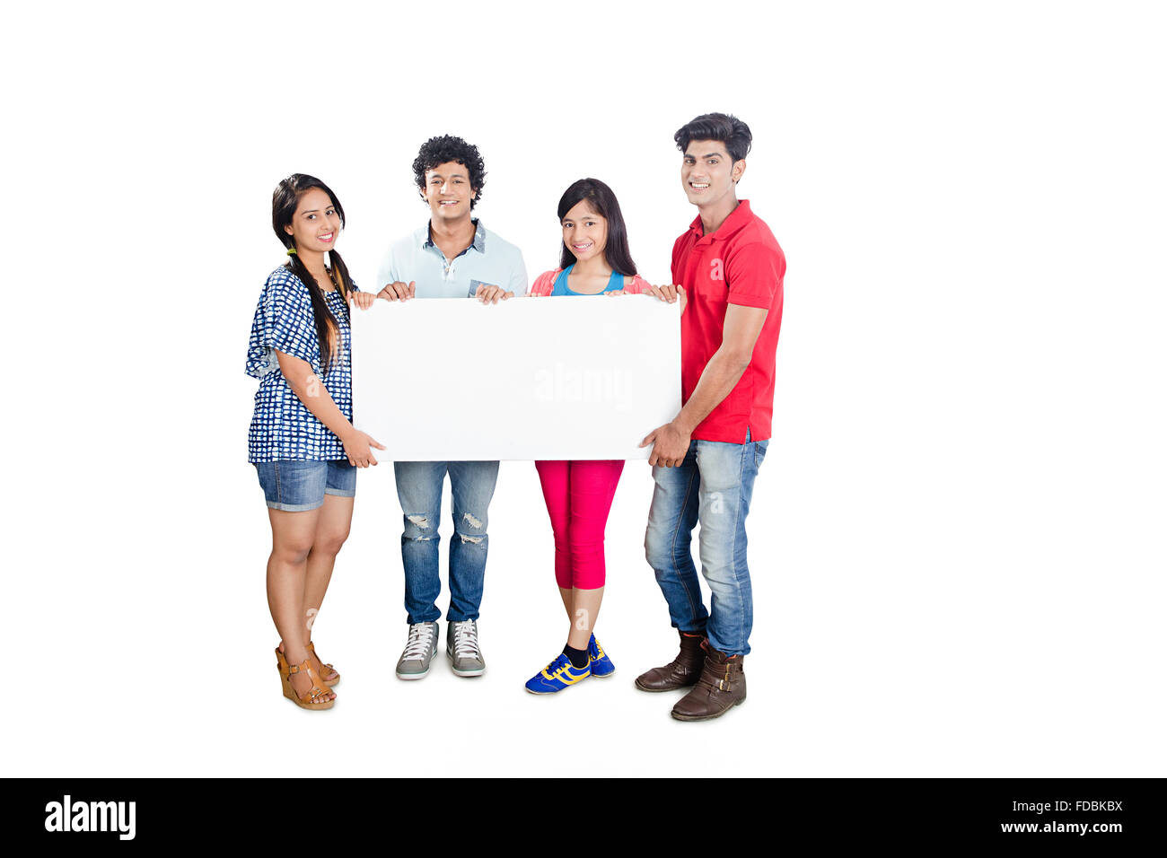 4 Teenagers friends College Student Standing Message board Showing Stock Photo