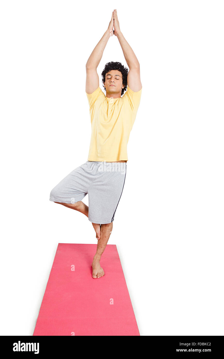 1 Young man Standing-on-one-leg Yoga Surya namaskar Stock Photo