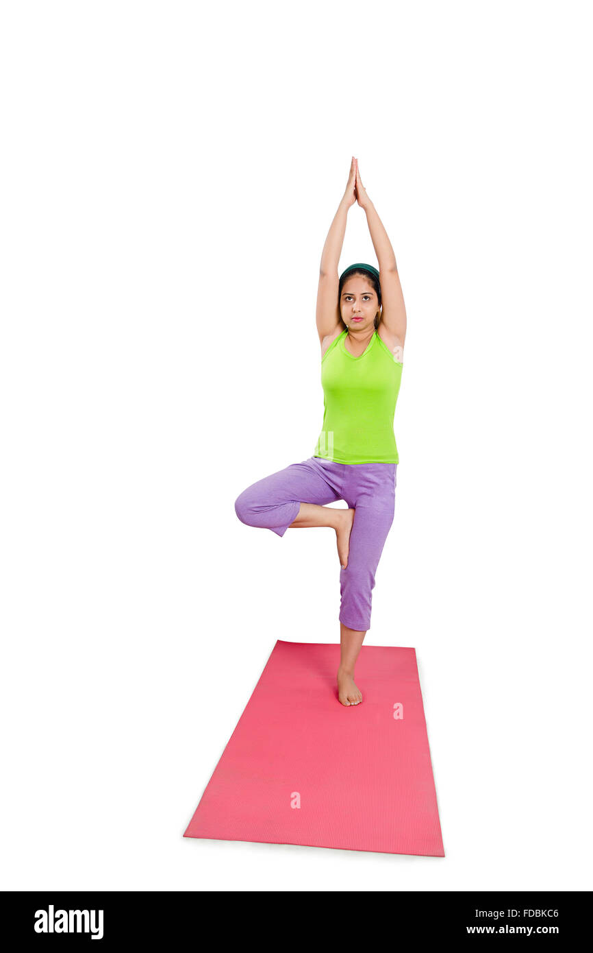 1 Young Woman Standing-on-one-leg Yoga Surya namaskar Stock Photo