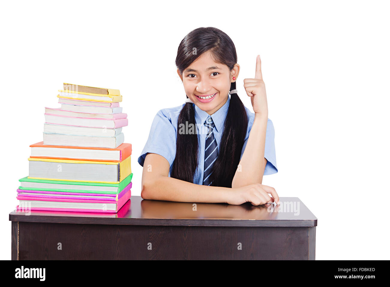 1 Young Teenager Girl School Student Classroom sitting Book Studying and Finger Pointing Showing Stock Photo