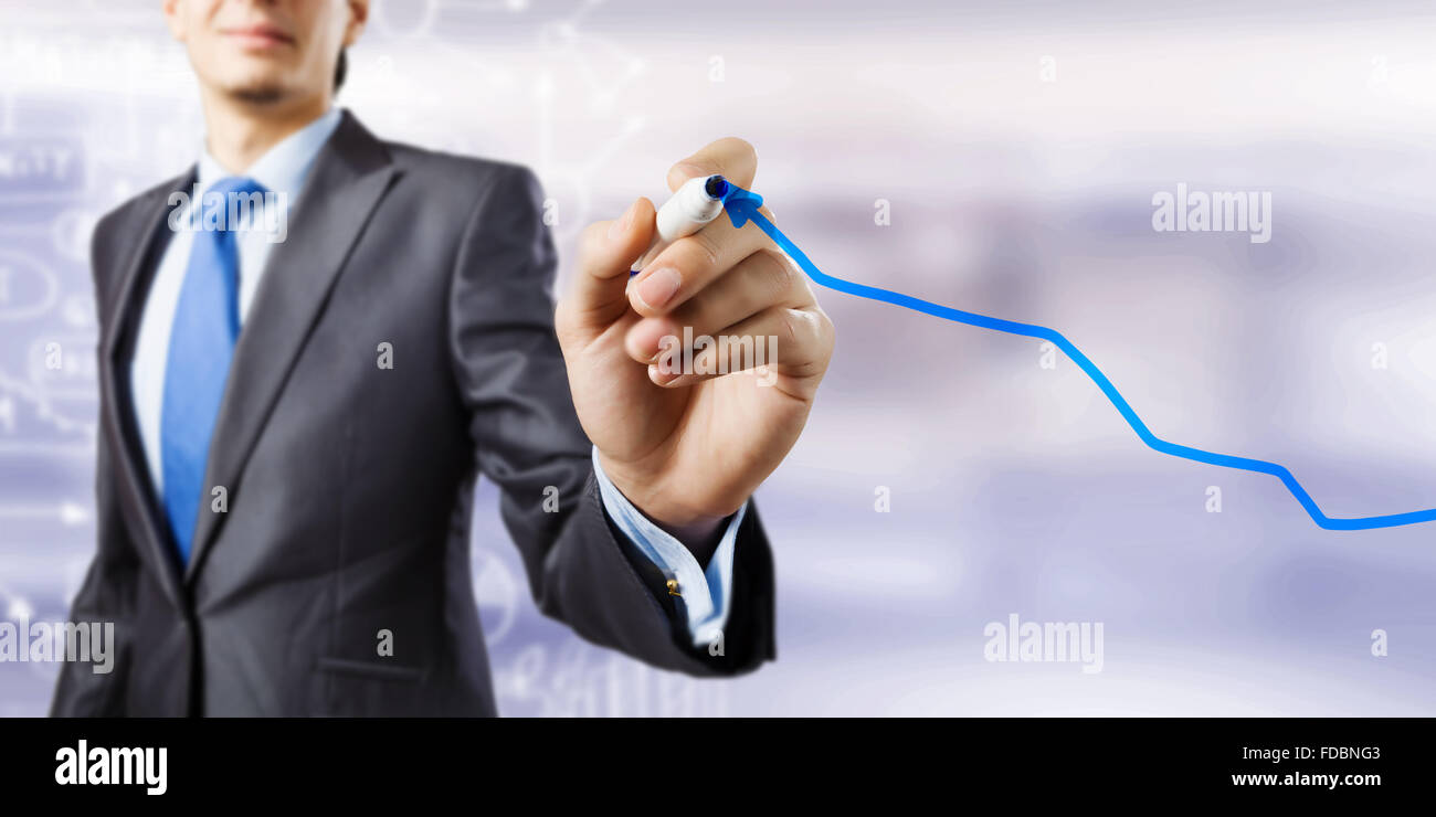 Close up of businessman drawing increasing graph with marker Stock ...