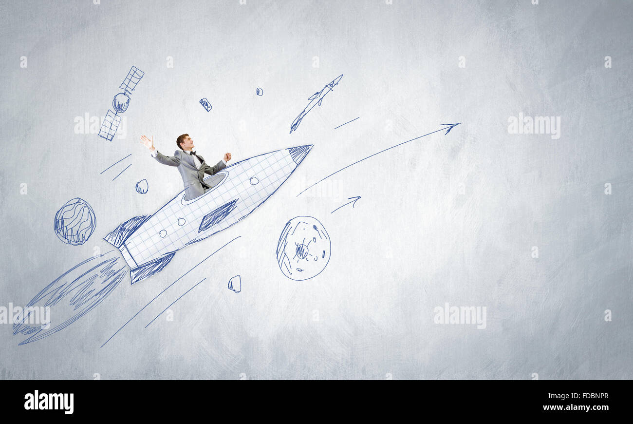 Young businessman,an flying in sky on drawn rocket Stock Photo - Alamy