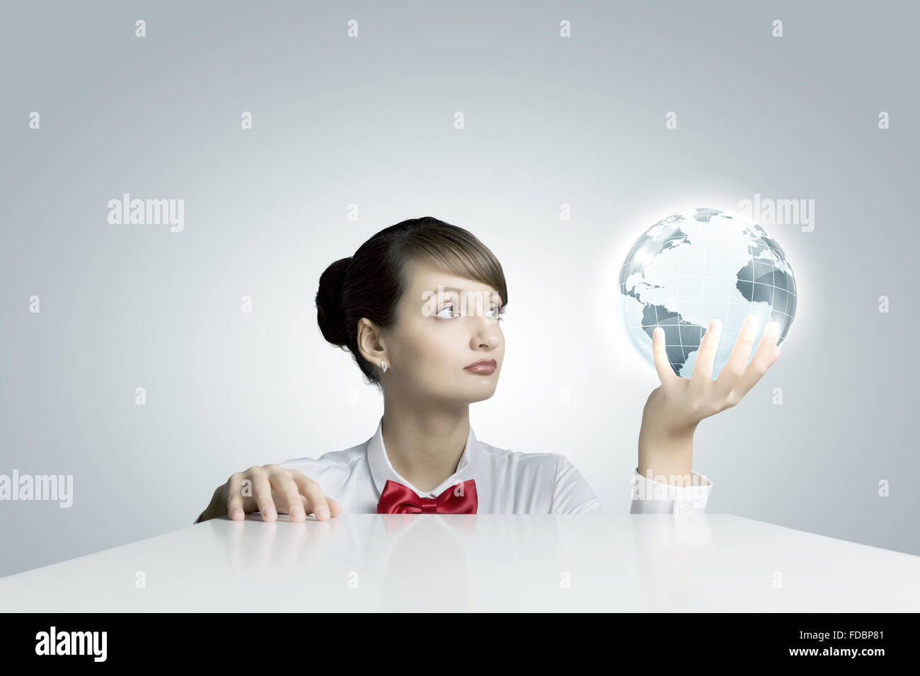Young woman holding digital Earth planet in hand Stock Photo - Alamy