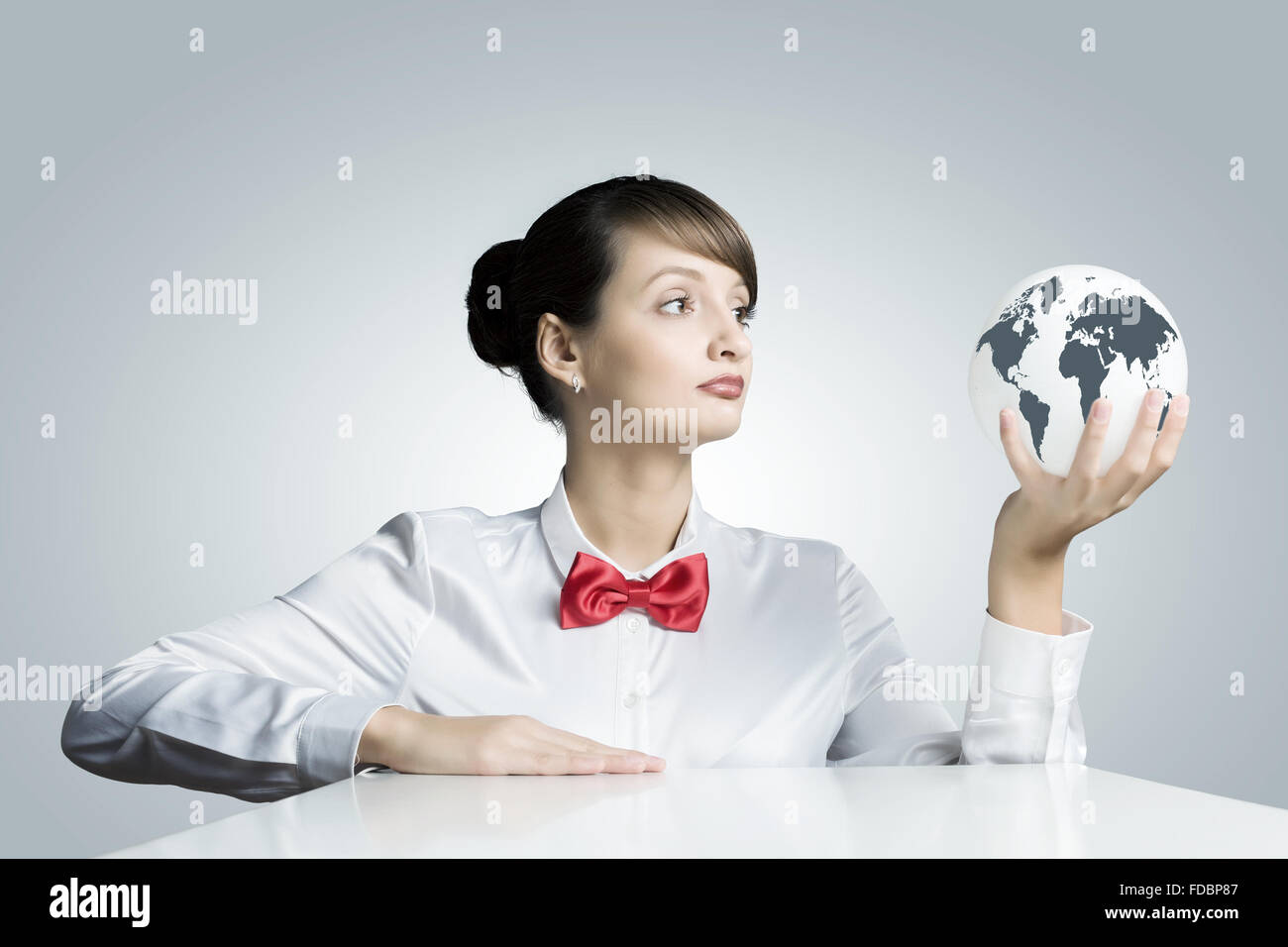 Young woman holding digital Earth planet in hand Stock Photo - Alamy